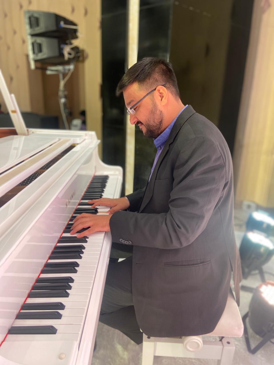 Piano Teacher with Student
